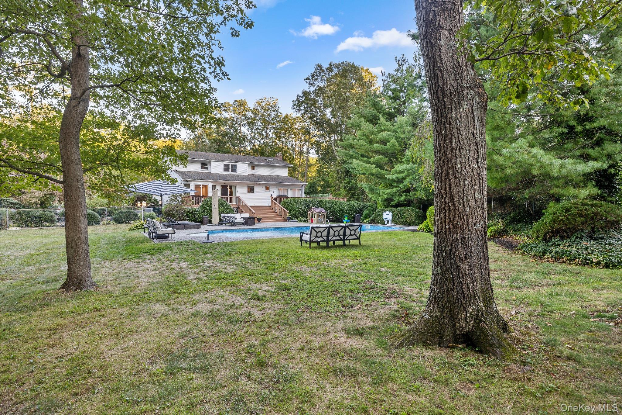 461 Wolf Hill Road Dix Hills, NY 11746 - Photo 36 of 37 a view of a house with a yard