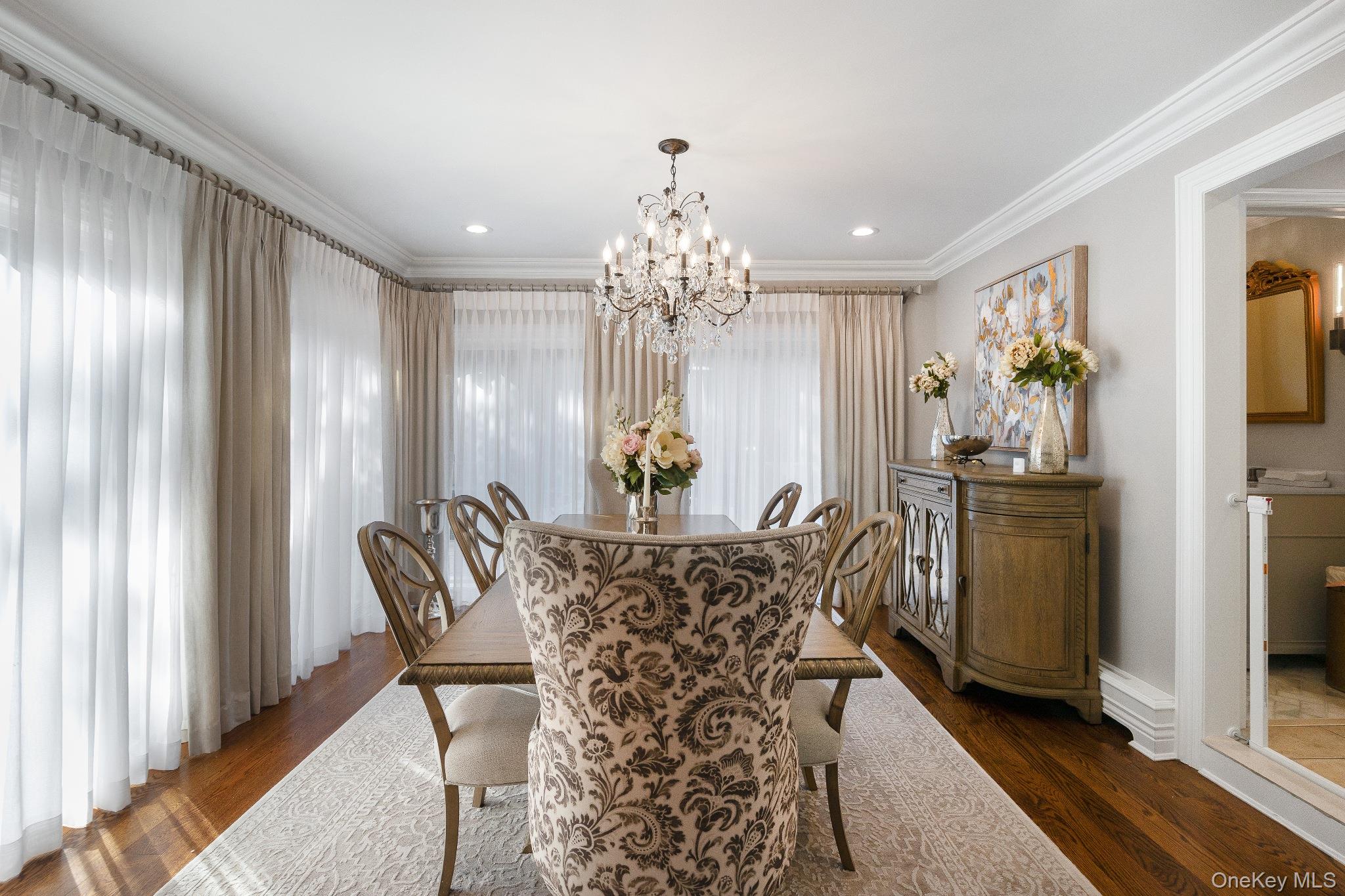 461 Wolf Hill Road Dix Hills, NY 11746 - Photo 9 of 37 a view of a dining room with furniture and chandelier