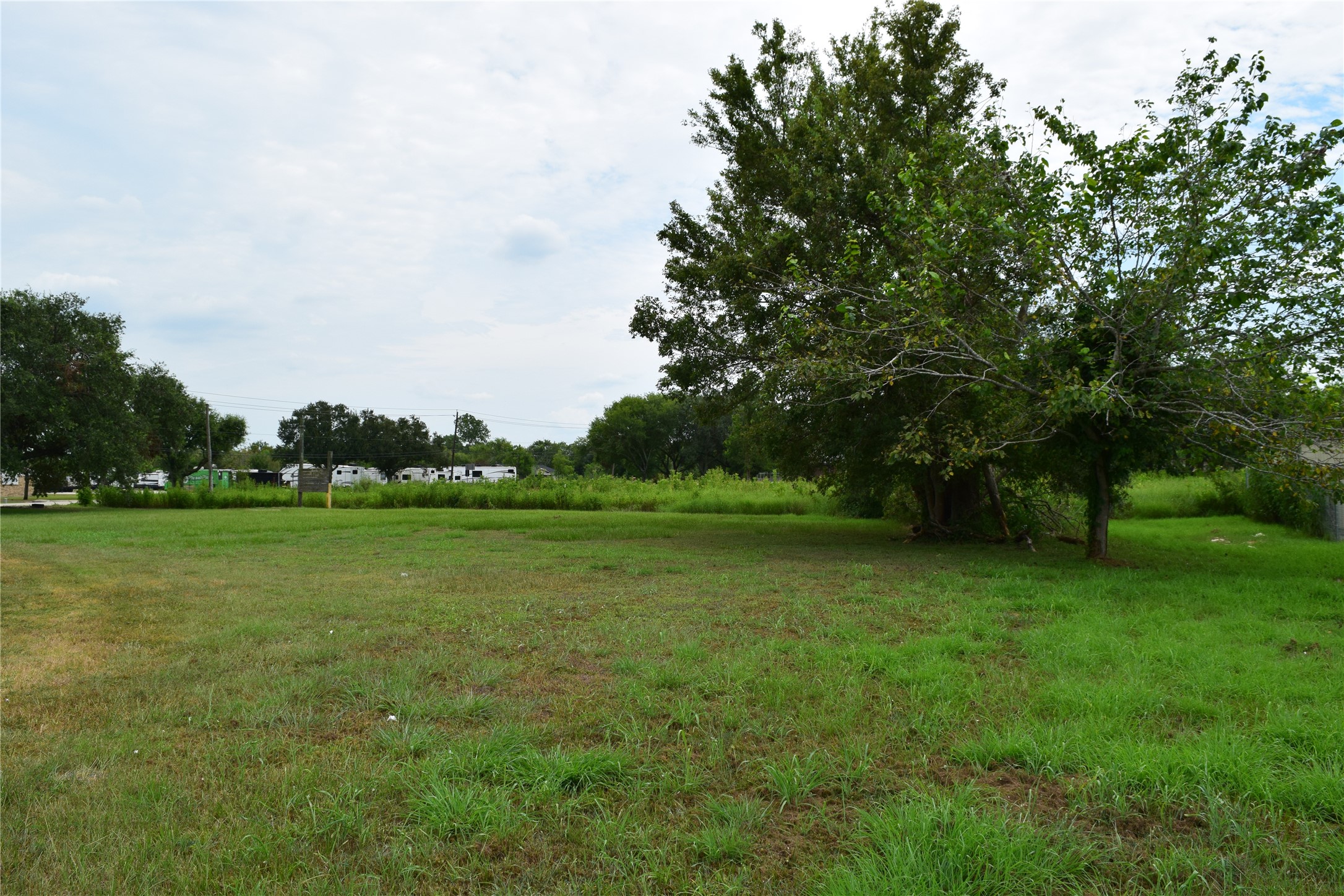 16622 McLean Road Pearland, TX 77584 - Photo 11 of 15 a view of a field of grass and trees