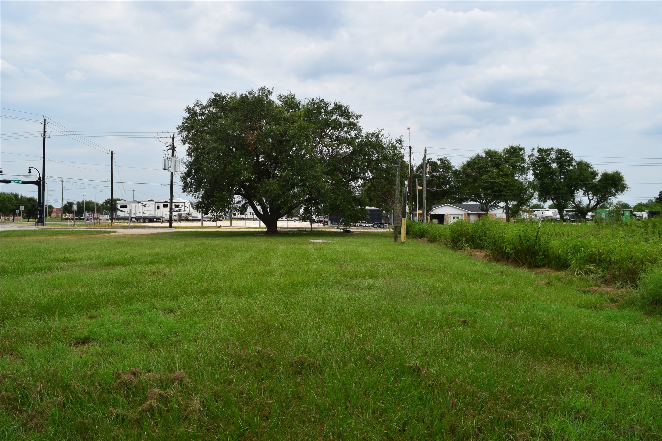 16622 McLean Road Pearland, TX 77584 - Photo 15 of 15 a view of grassy field with benches and trees