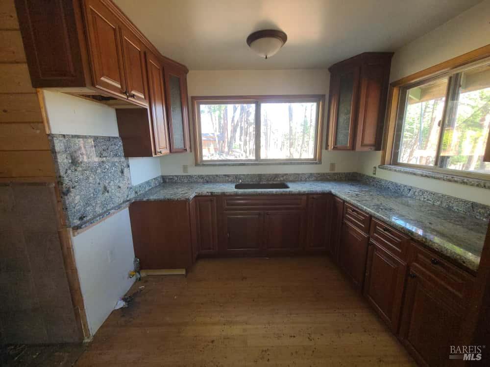 41390 Mendocino Pass Road Covelo, CA 95428 - Photo 17 of 44 a kitchen with a sink stove and cabinets