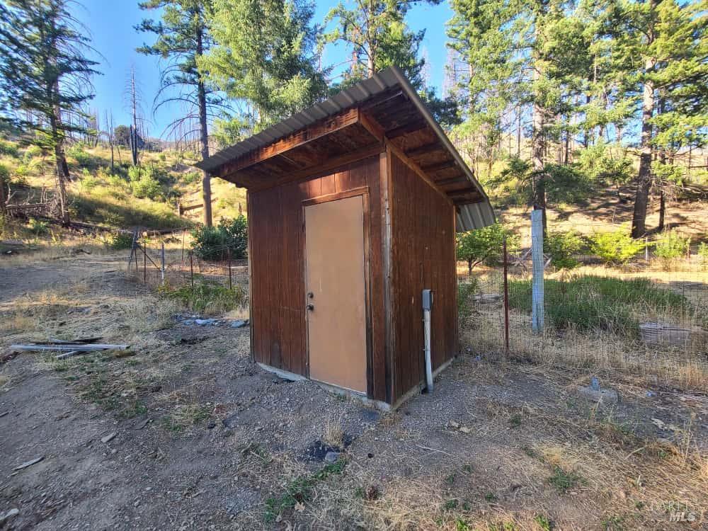 41390 Mendocino Pass Road Covelo, CA 95428 - Photo 26 of 44 a view of a house with a yard