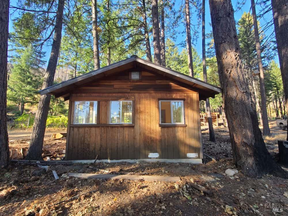 41390 Mendocino Pass Road Covelo, CA 95428 - Photo 27 of 44 a front view of a house with a yard