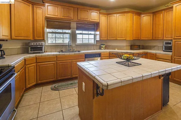 a bedroom with a bed and cabinets