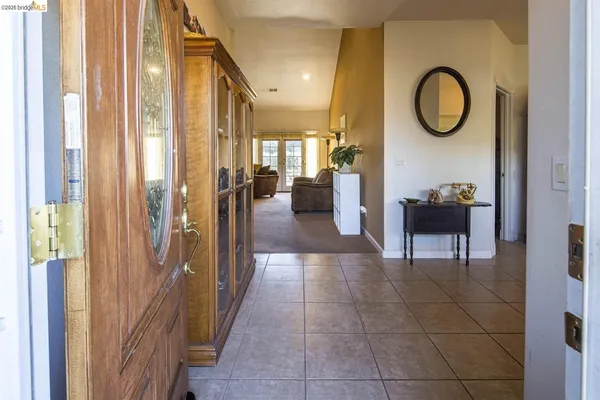 a kitchen with a table and chairs