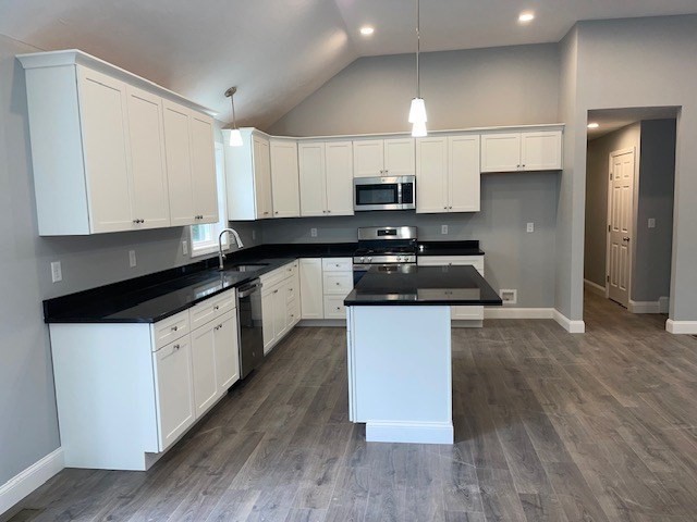 2 Peyton Lane Wareham, MA 02571 - Photo 6 of 10 a kitchen with granite countertop a sink a stove and cabinets