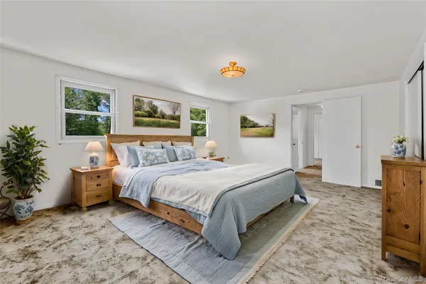 a bedroom with bed and window