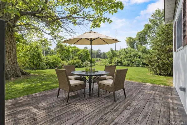 a view of a wooden deck and a yard