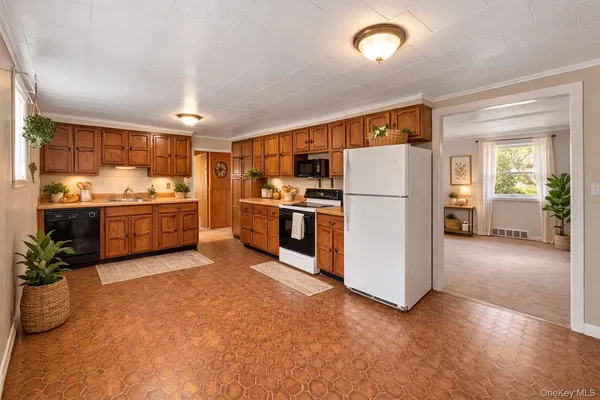 a kitchen with stainless steel appliances a refrigerator and a stove