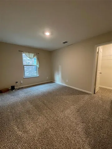 a view of an empty room and window