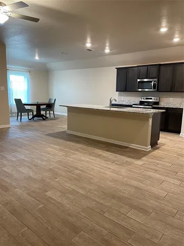 a view of a kitchen with a sink