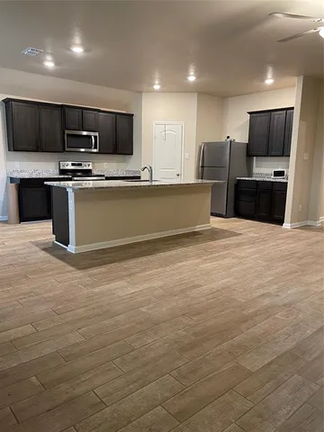 a view of a dining room with furniture and window