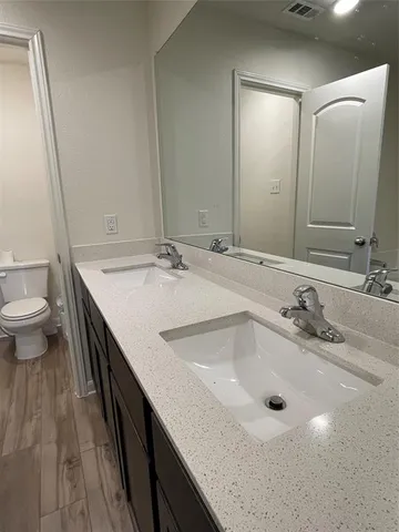 a spacious bathroom with a bathtub and shower