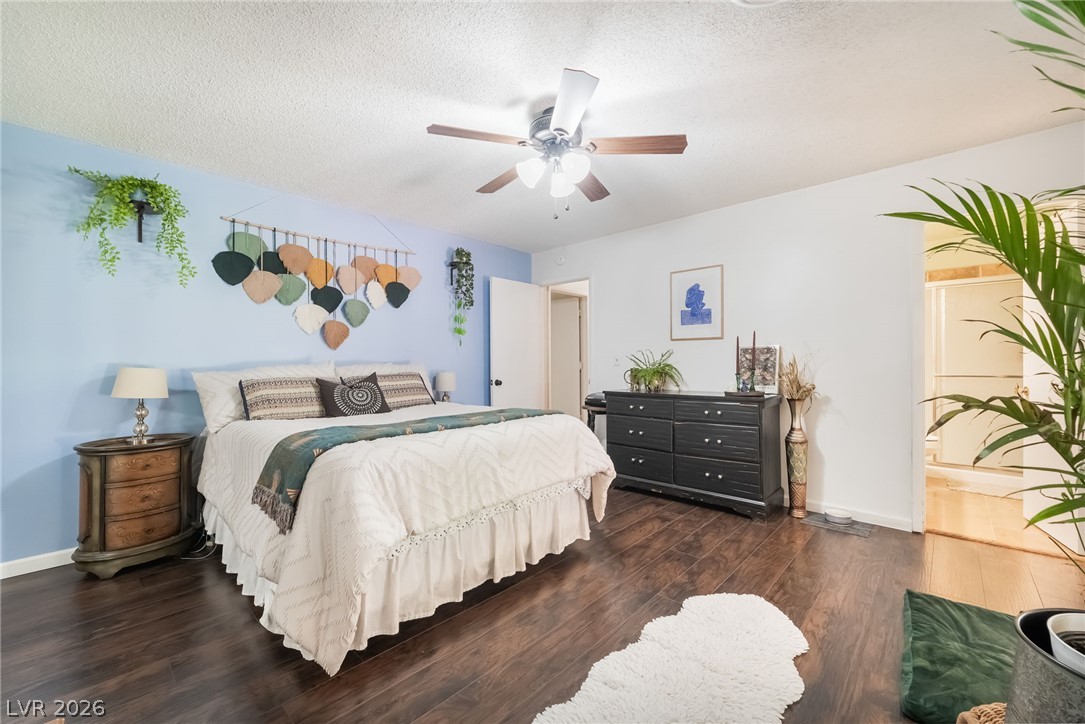 1324 Appaloosa Road Boulder City, NV 89005 - Photo 19 of 38 Rich wood floors lay a warm foundation for this comfortable, well-proportioned bedroom retreat.