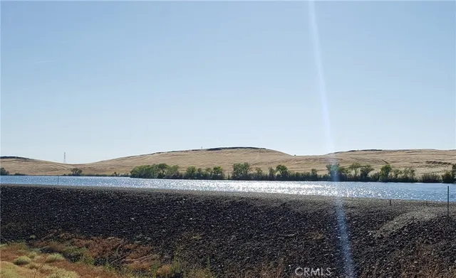 a view of an ocean and a mountain