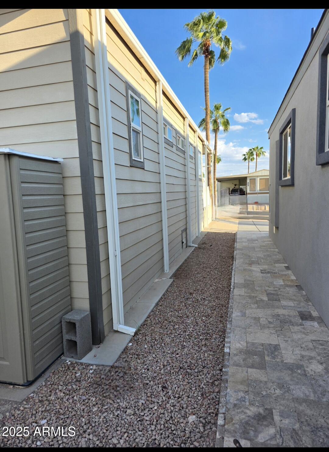 1347 West Inuit Avenue, Unit 347 Apache Junction, AZ 85119 - Photo 2 of 6 a view of a backyard with a table and chairs