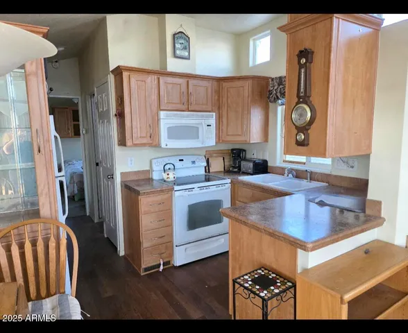 a kitchen with a refrigerator and a sink