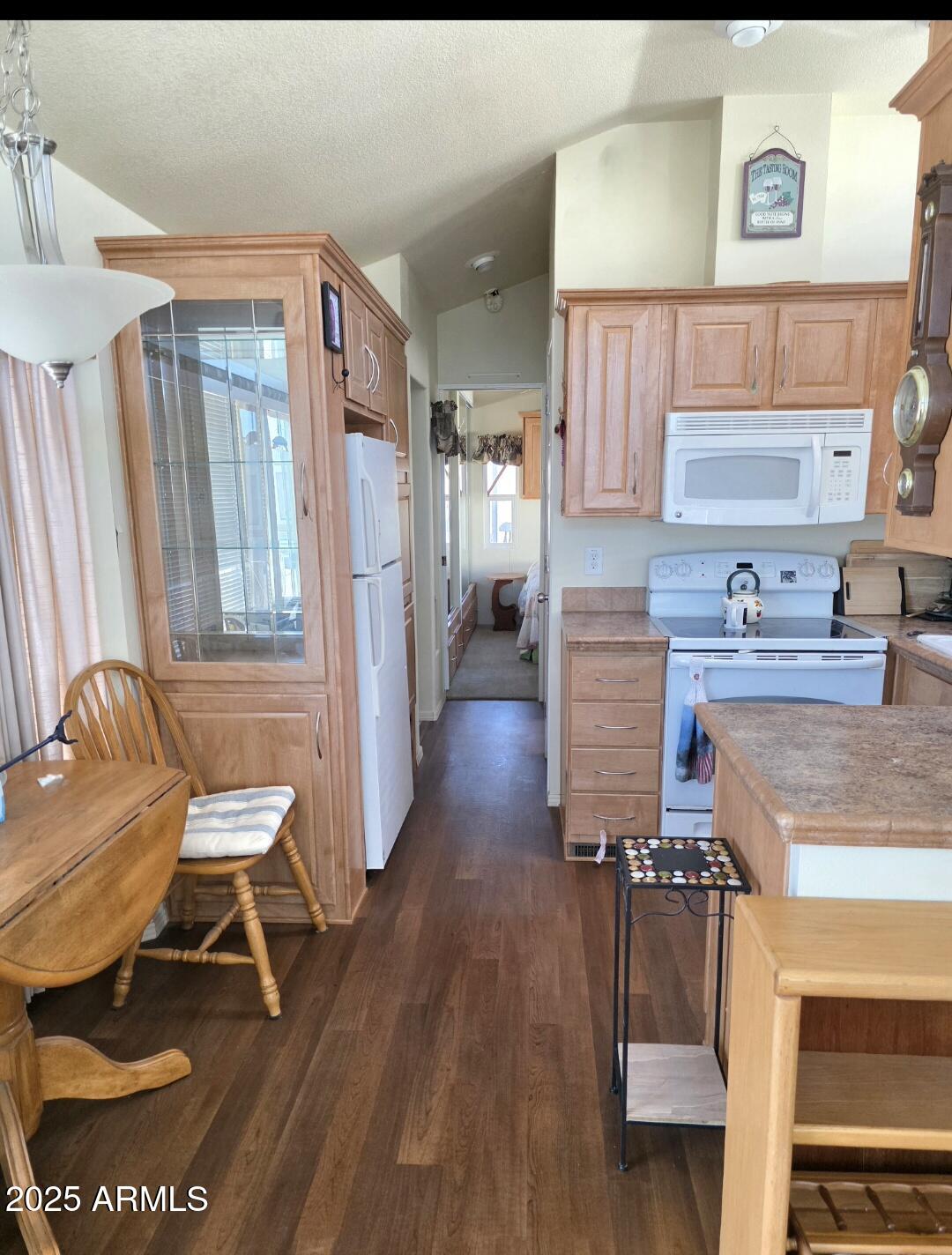 1347 West Inuit Avenue, Unit 347 Apache Junction, AZ 85119 - Photo 5 of 6 a living room with furniture and a wooden floor