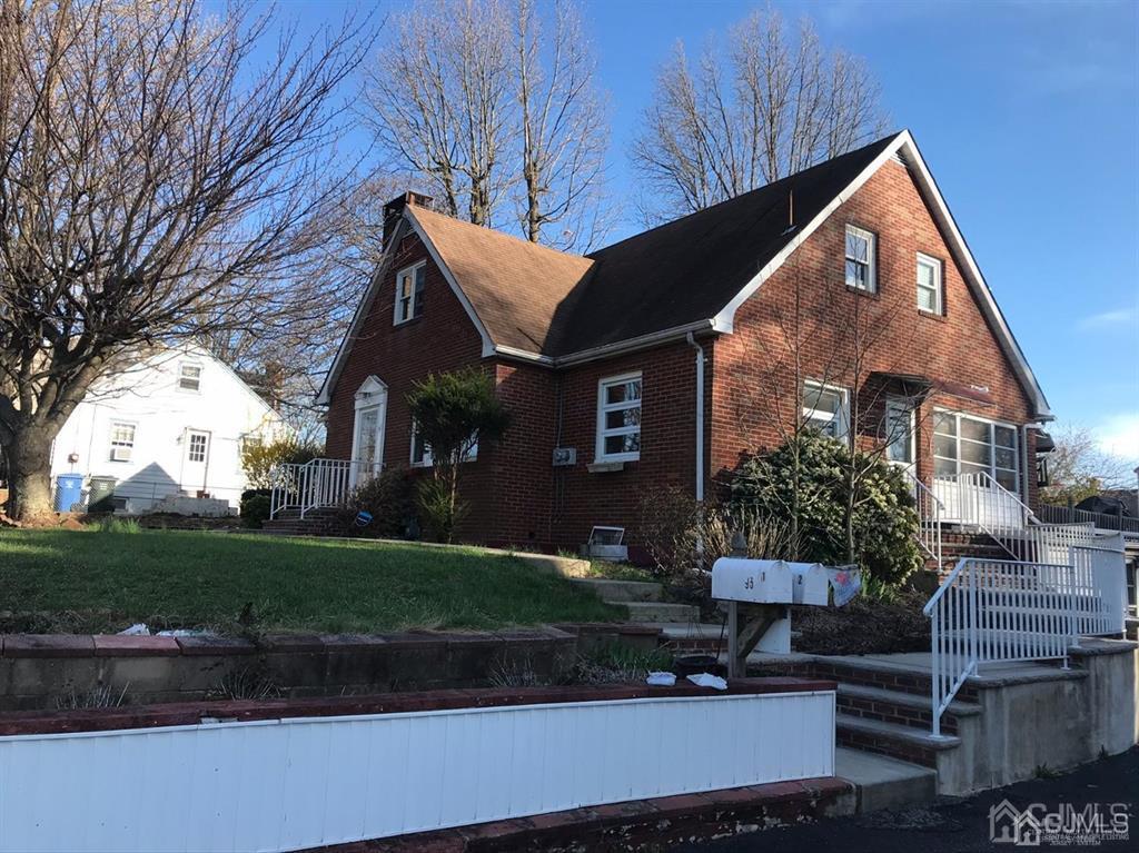 95 Highfield Road Colonia, NJ 07067 - Photo 1 of 5 a front view of a house with garden