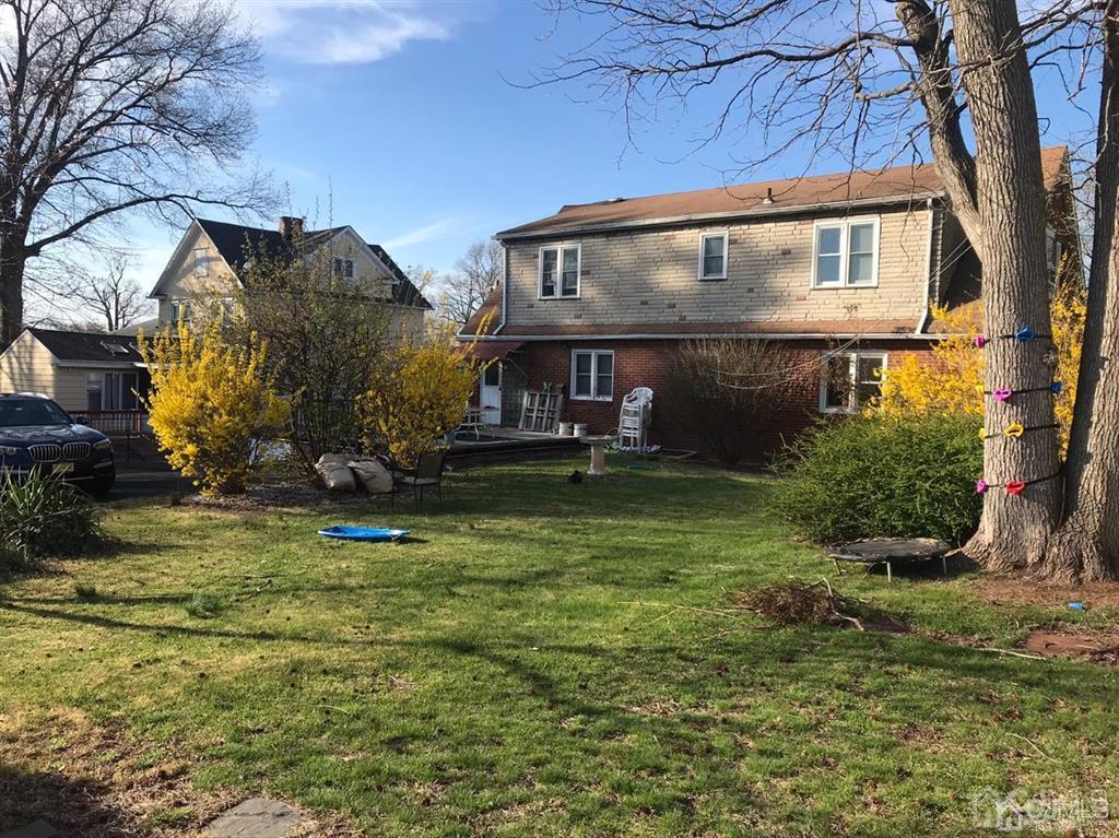 95 Highfield Road Colonia, NJ 07067 - Photo 2 of 5 front view of house with a yard