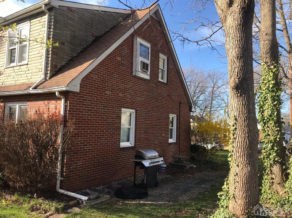 95 Highfield Road Colonia, NJ 07067 - Photo 3 of 5 a backyard of a house with yard and garage