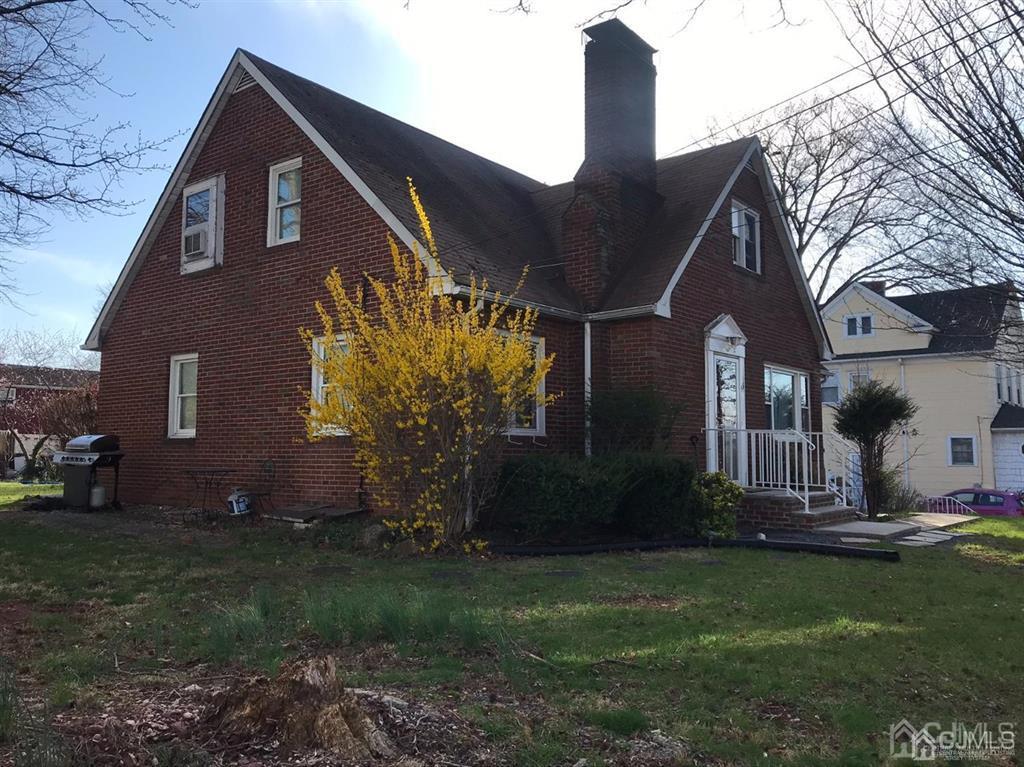 95 Highfield Road Colonia, NJ 07067 - Photo 4 of 5 a front view of house with garden