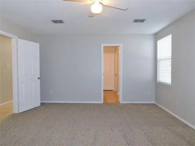 a view of an empty room and window