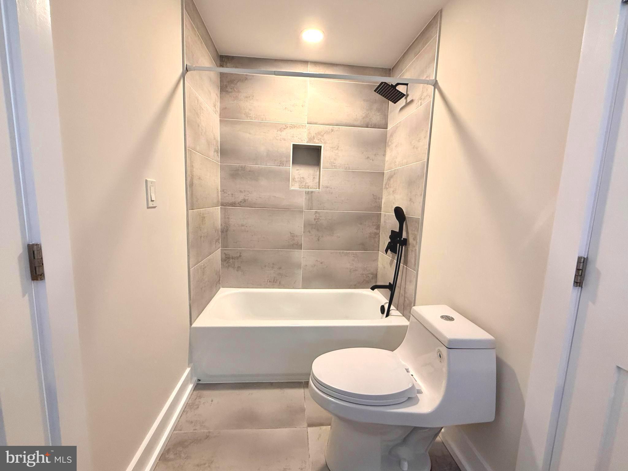 310 South Alfred Street Alexandria, VA 22314 - Photo 31 of 63 a bathroom with a toilet and a shower