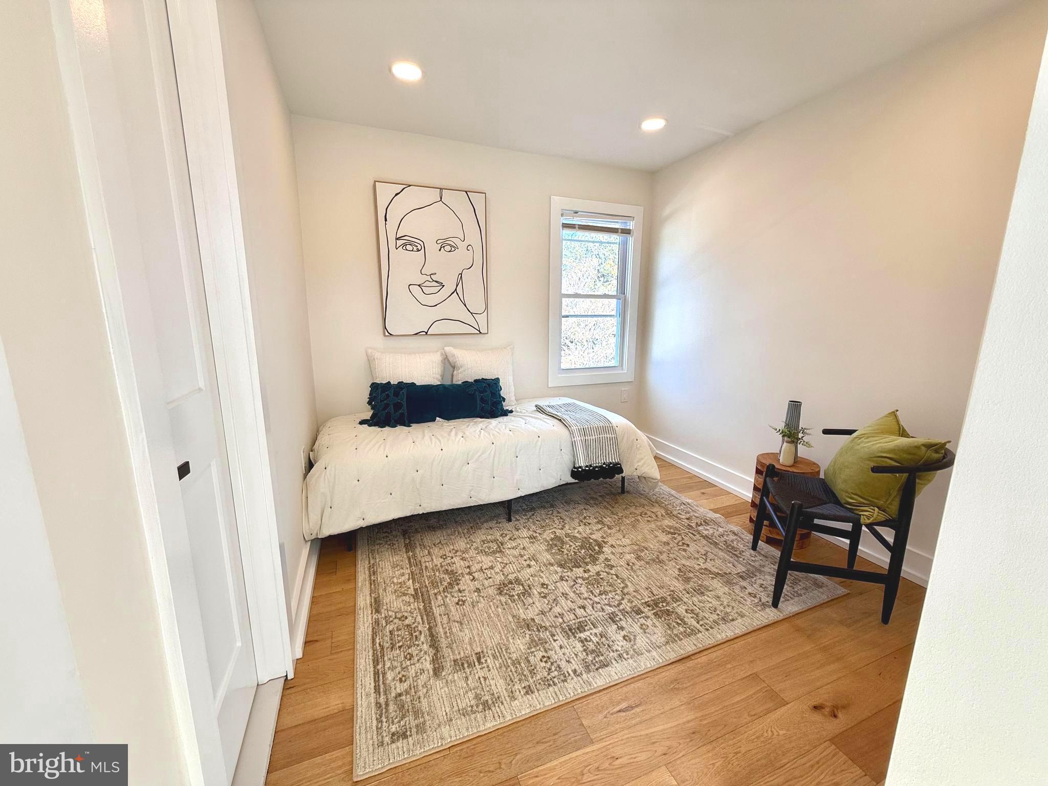 310 South Alfred Street Alexandria, VA 22314 - Photo 34 of 63 a bedroom with a bed and wooden floor