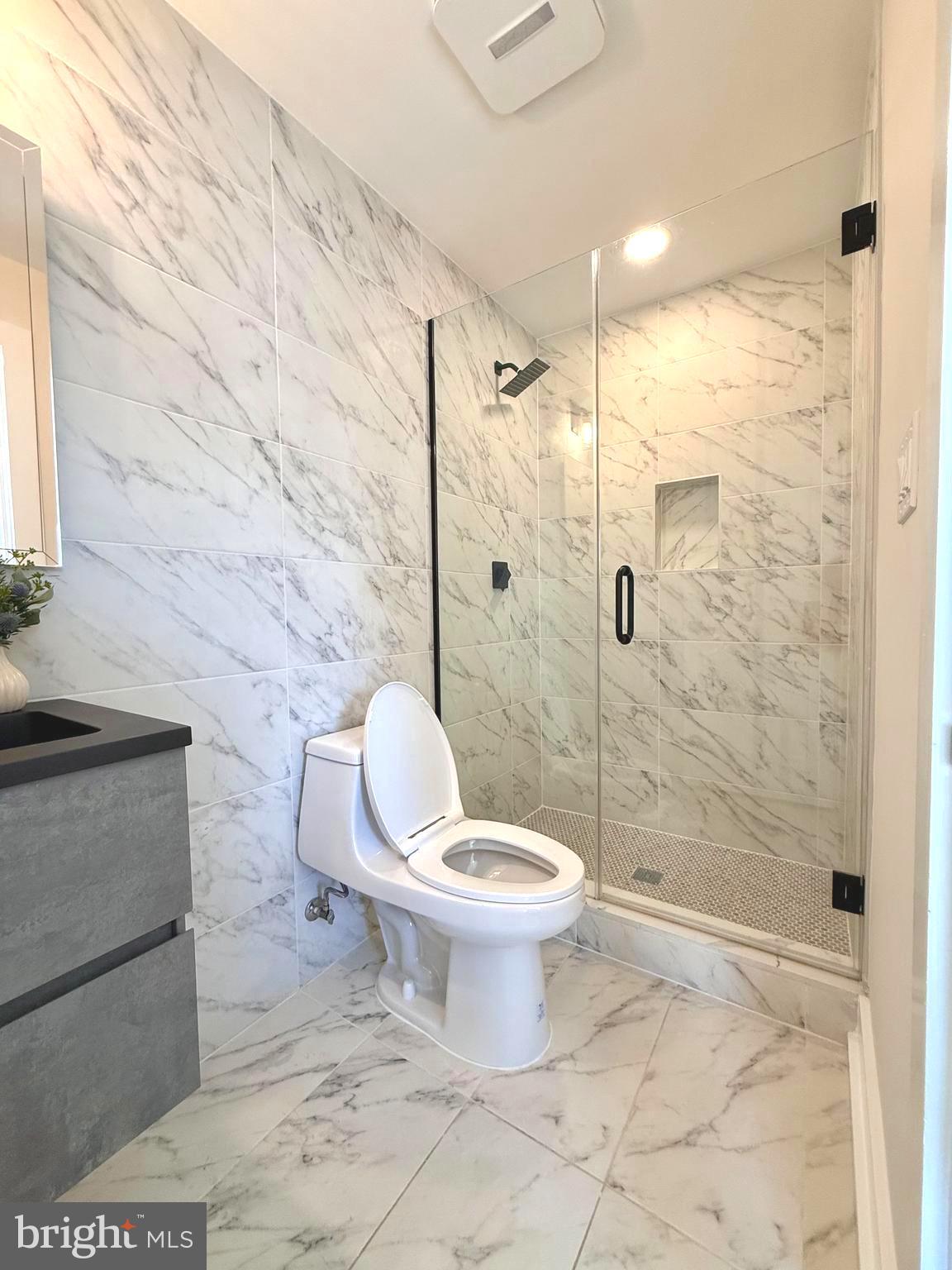 310 South Alfred Street Alexandria, VA 22314 - Photo 39 of 63 a bathroom with a toilet sink and shower