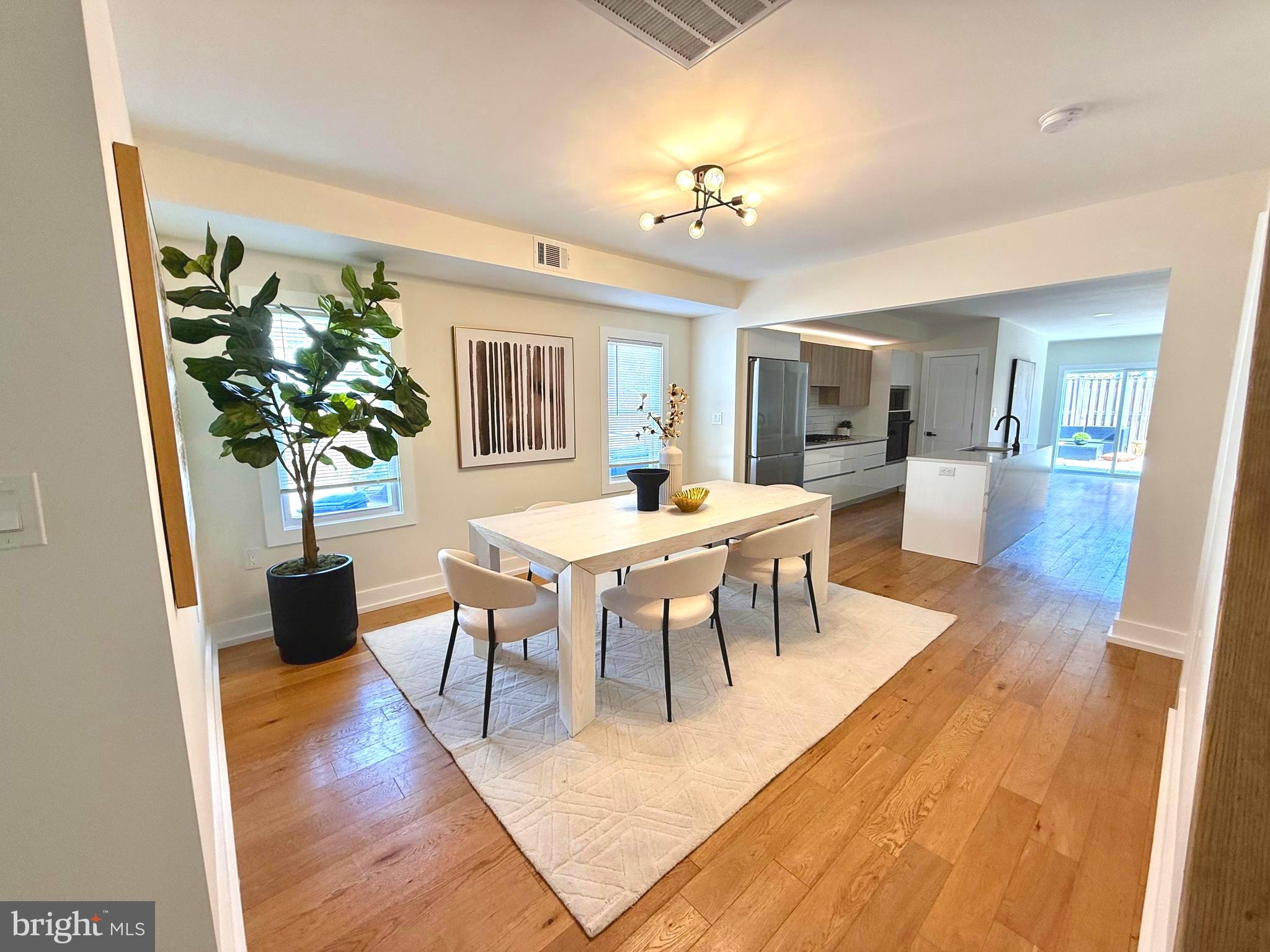 310 South Alfred Street Alexandria, VA 22314 - Photo 5 of 63 a view of a dining room with furniture and wooden floor