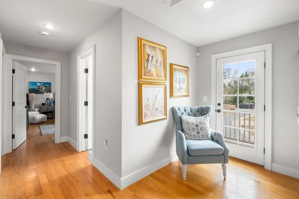 a bedroom with a bed and a chair