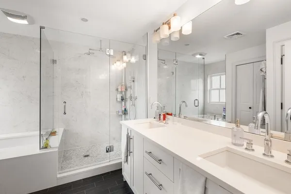 a view of a backyard with a garden and trees