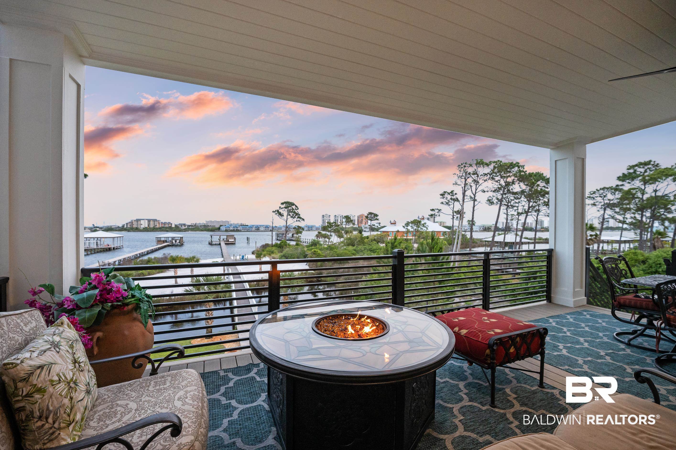 30954 River Road Orange Beach, AL 36561 - Photo 17 of 59 View of patio featuring a water view, a balcony, and a fire pit