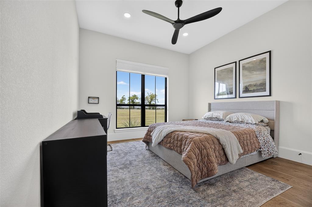 10932 Gregory Road Sanger, TX 76266 - Photo 32 of 40 Vaulted ceiling with recessed lighting and a modern ceiling fan