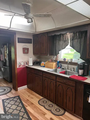 a kitchen with a wooden cabinets and a stove