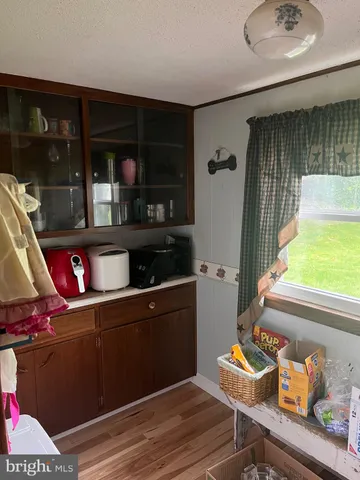 a room with wooden floor and furniture