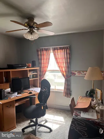 a workspace with furniture and a window