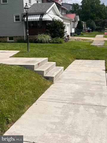 a view of a patio with a yard