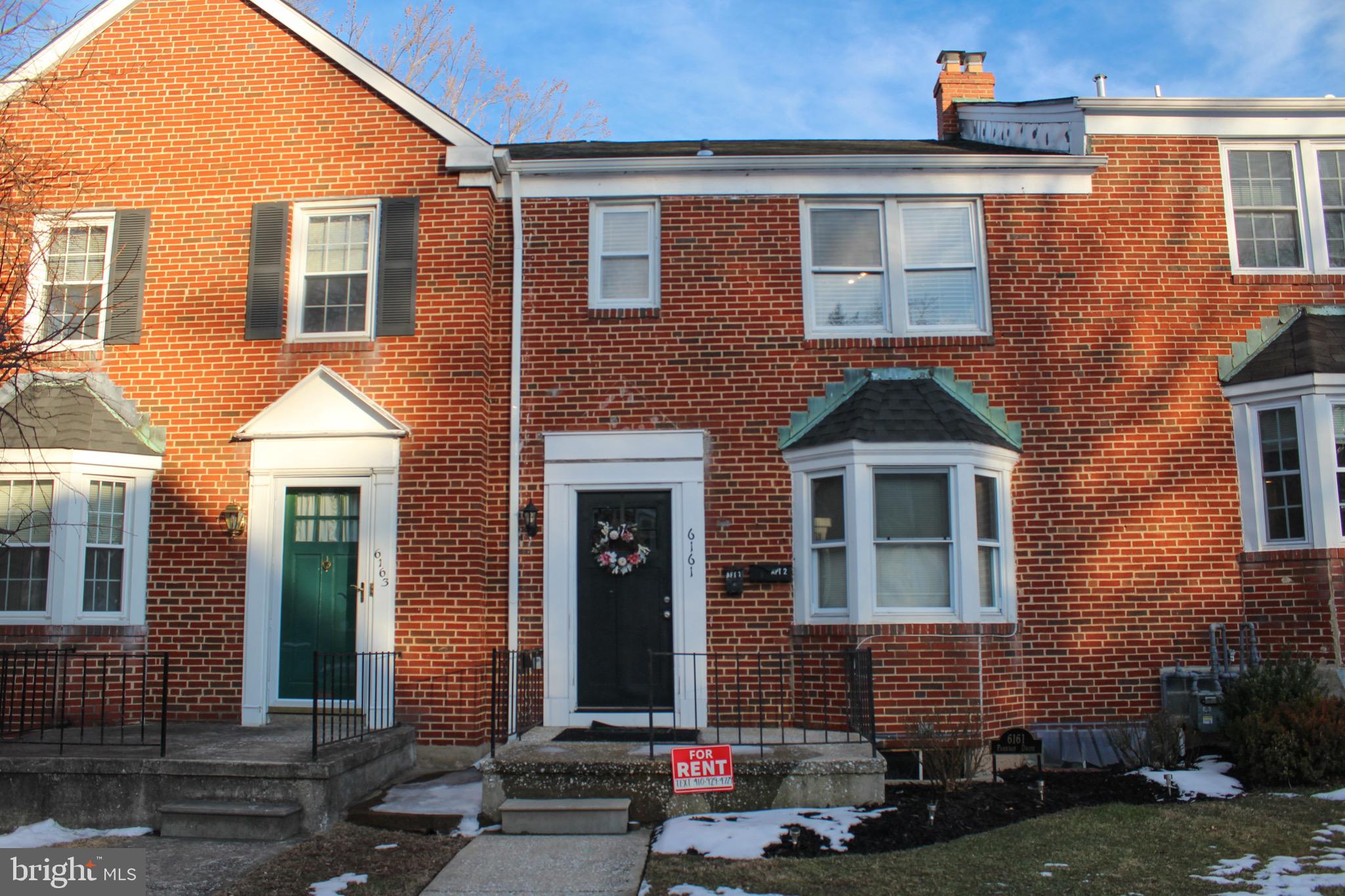 6161 Parkway Drive, Unit 2 Baltimore, MD 21212 - Photo 1 of 24 a front view of a house with a yard