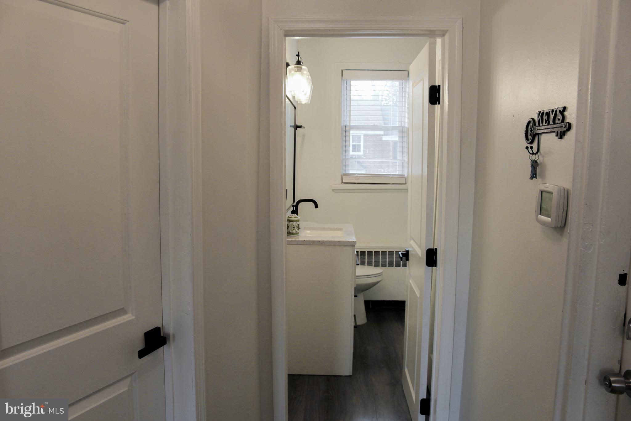 6161 Parkway Drive, Unit 2 Baltimore, MD 21212 - Photo 12 of 24 a bathroom with a sink and shower