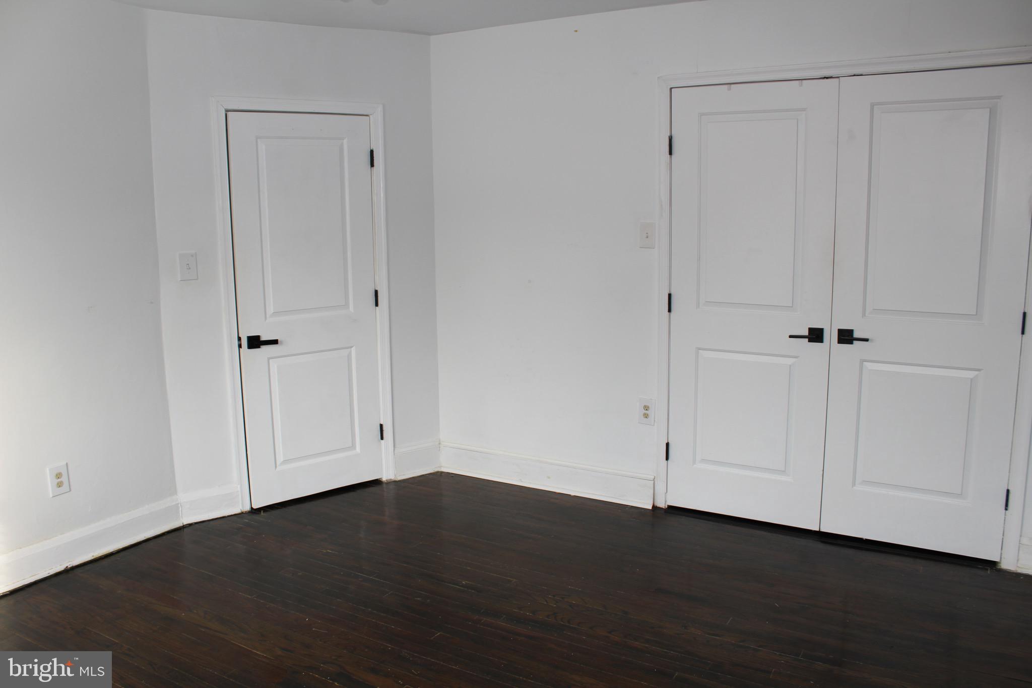 6161 Parkway Drive, Unit 2 Baltimore, MD 21212 - Photo 17 of 24 a view of an empty room with wooden floor