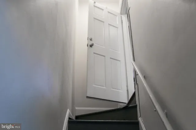 a bedroom with a bed and a mirror