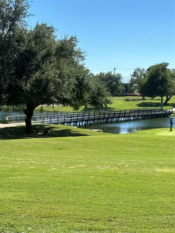 a view of a swimming pool with an outdoor space and seating area