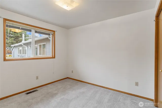a view of a bathroom from a hallway