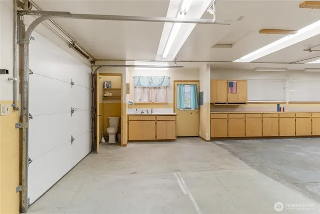a view of a room with gym equipment and windows