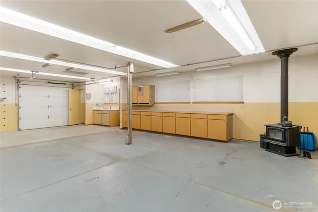a large white kitchen with a stove and a refrigerator