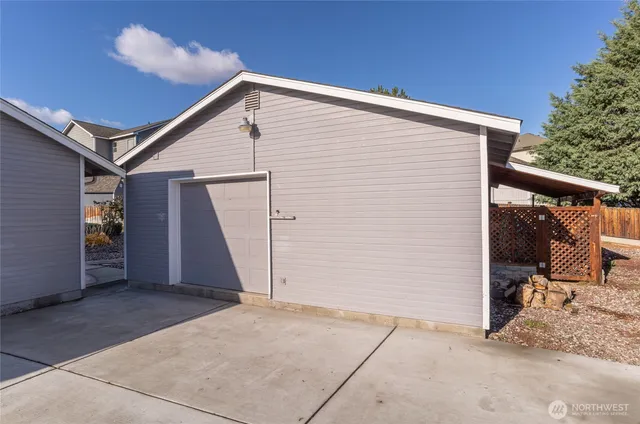 a view of a house with wooden fence