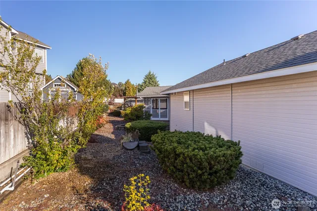 a view of garage with parked cars