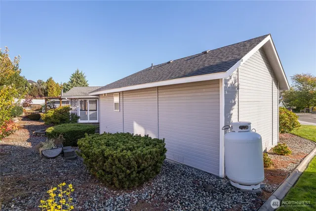 a view of a house with a yard and plants
